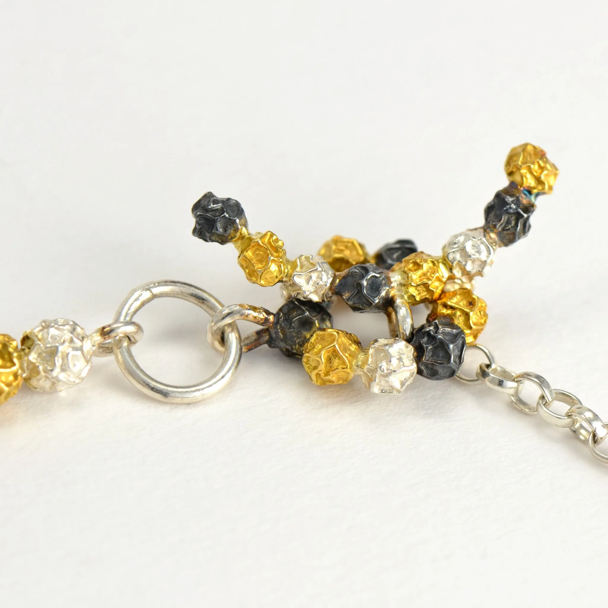 A silver and golden three peppercorn stick bracelet, fruit Bracelet Design