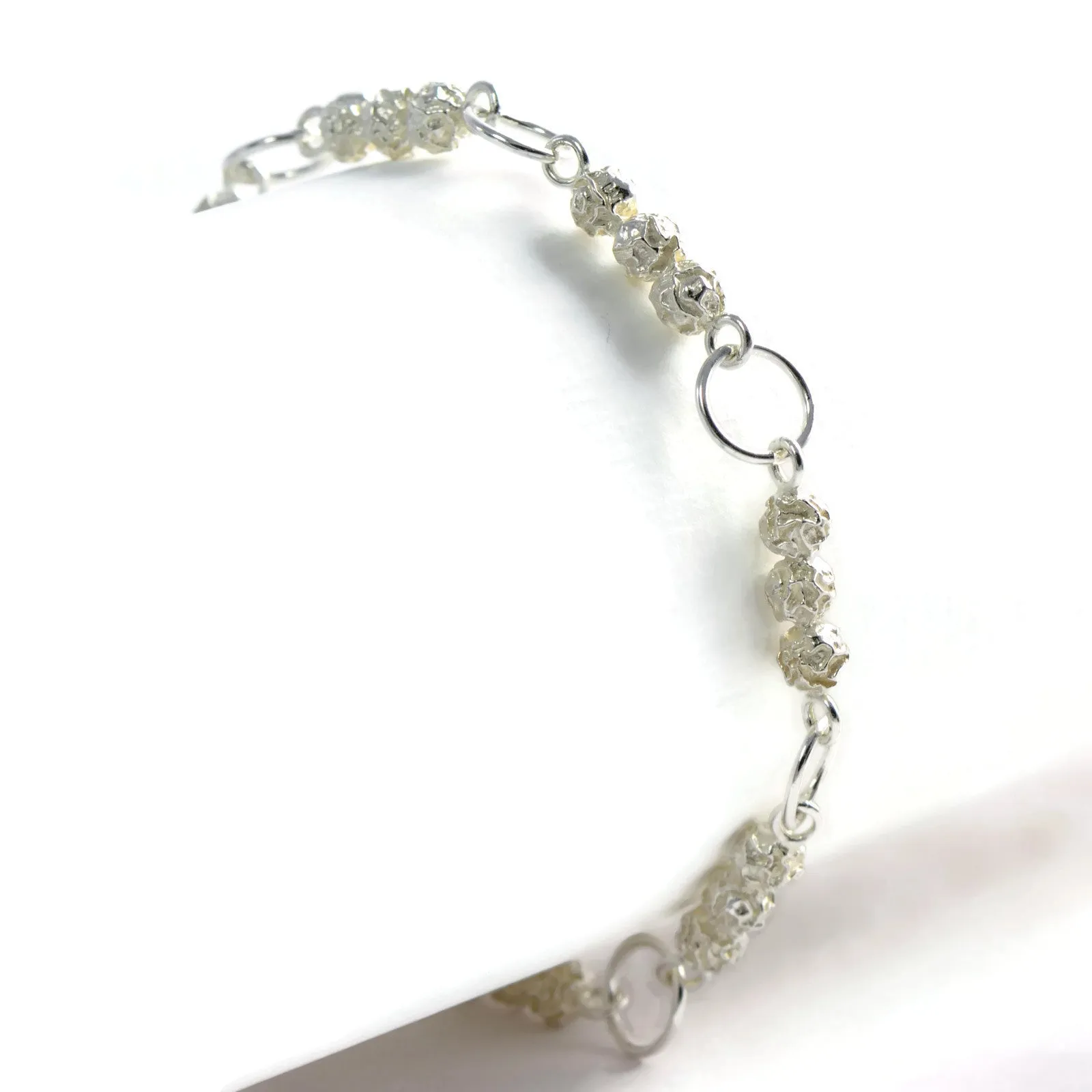 A silver and golden three peppercorn stick bracelet, fruit Bracelet Design